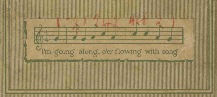 Detail from the front cover of a gospel annual songbook with a fragment of a musical melody.